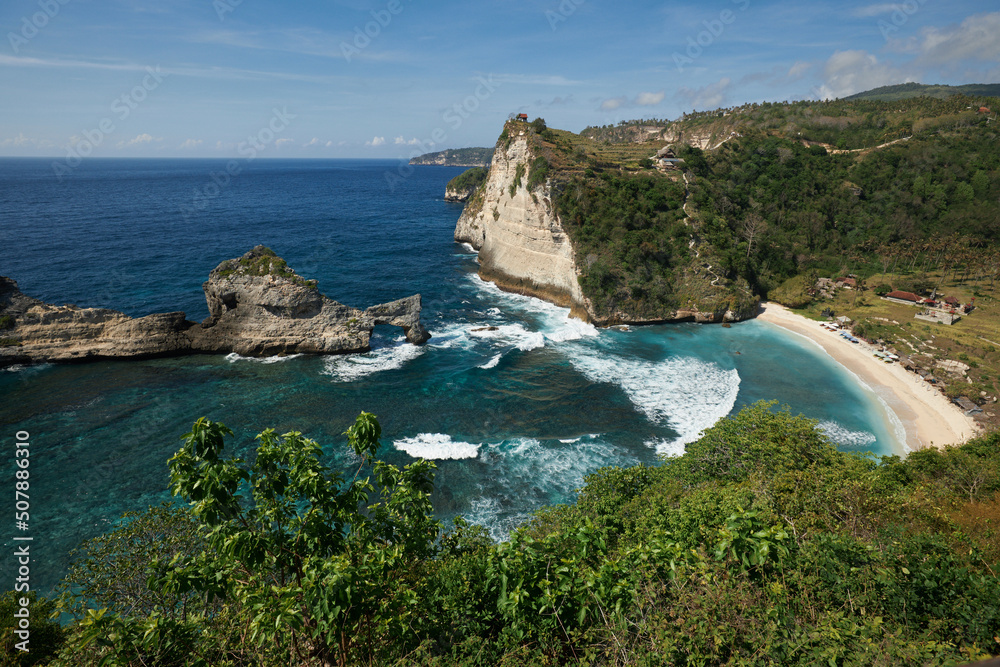 Natural Rock Arch in Ocean Water and Atuh Beach viewpoint in Nusa Penida island, Bali, Indonesia