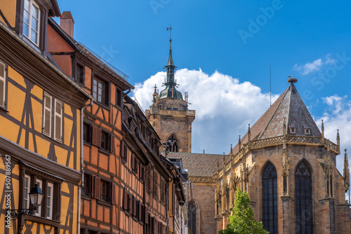 Church of St. Martin and colorful half-timbered houses in the historic center of Colmar