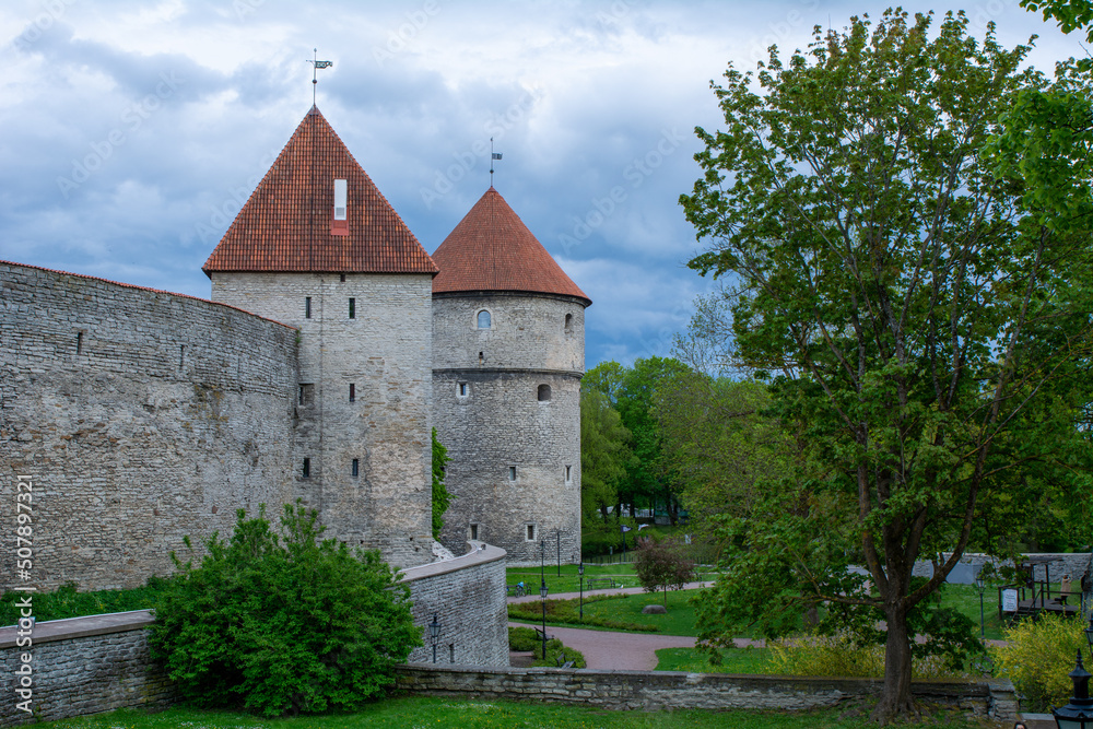 Walls and towers of old Tallinn, Estonia against a dramatic sky