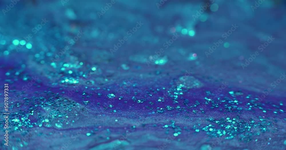 Glitter fluid. Acrylic paint motion. Blue liquid paint flow abstract background shot on RED Cinema camera. Glitter fluid. Acrylic paint motion. Blue liquid paint flow abstract background shot on RED Cinema camera.