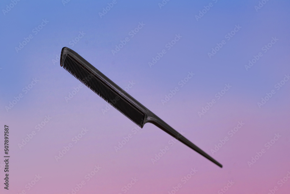 Naklejka premium Professional tools from a beauty salon on a pink blurred background