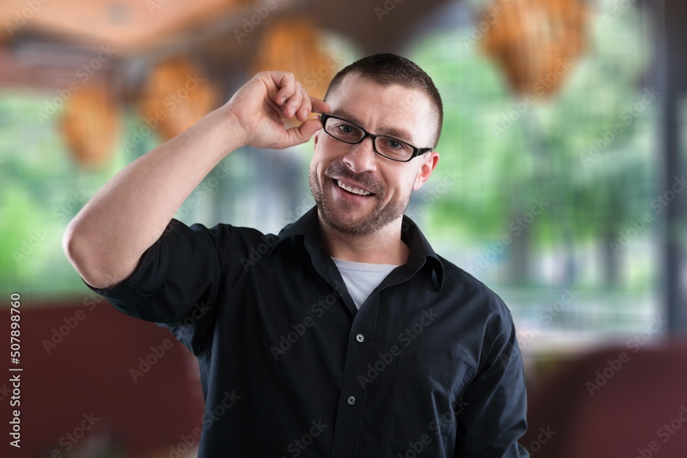 Young caucasian guy in office space. Concept of rest and break at work. Idea of modern successful man. Young caucasian guy in office space. Concept of rest and break at work. Idea of modern successful man.