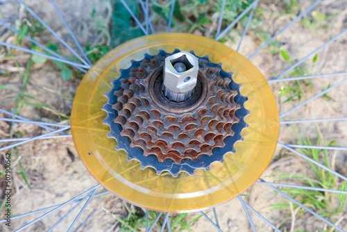 Close-up image of and old bicycle's rusty gears