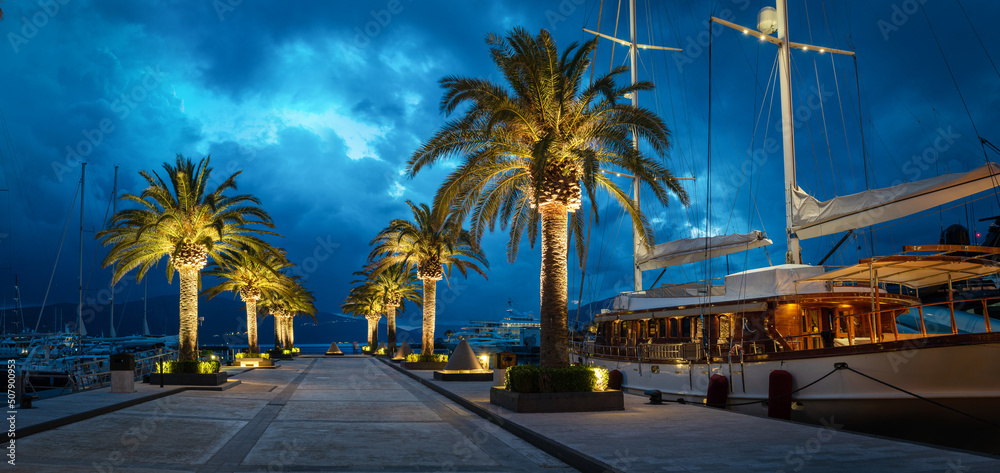 Obraz premium Evening panoramic view of the sea port of Montenegro.,Tivat. Luxury yachts and sailing boats in the port of Montenegro. Tivat. Kotor bay, Adriatic sea.