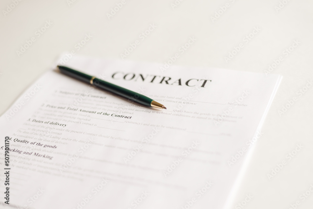 Pen for signing the contract papers on office desk Pen for signing the contract papers on office desk