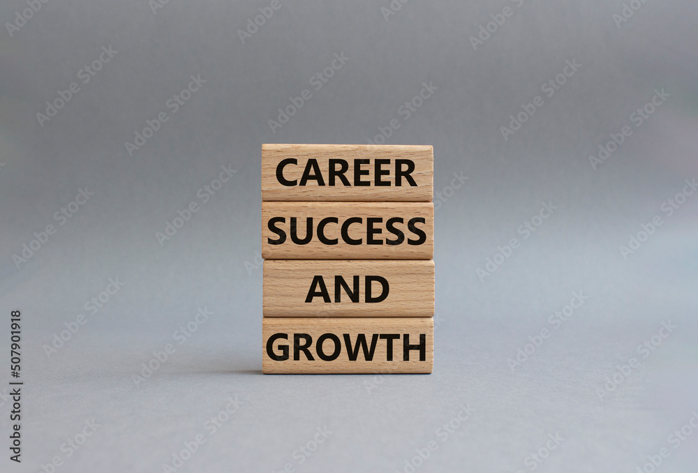 Career success and growth symbol. Wooden blocks with words Career success and growth. Beautiful yellow background. Businessman hand. Business and Career success and growth concept. Copy space. Career success and growth symbol. Wooden blocks with words Career success and growth. Beautiful yellow background. Businessman hand. Business and Career success and growth concept. Copy space.