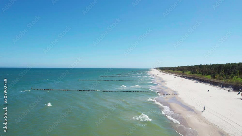 long peninsula with beautiful sandy beach on a summer day (aerial view) long peninsula with beautiful sandy beach on a summer day (aerial view)