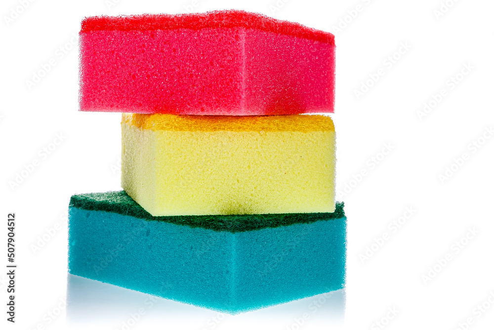 Set of multicolored sponges, kitchen cleaners with abrasive surface for dish washing and cleaning isolated on white background. Housekeeping and hygiene concept. Set of multicolored sponges, kitchen cleaners with abrasive surface for dish washing and cleaning isolated on white background. Housekeeping and hygiene concept.