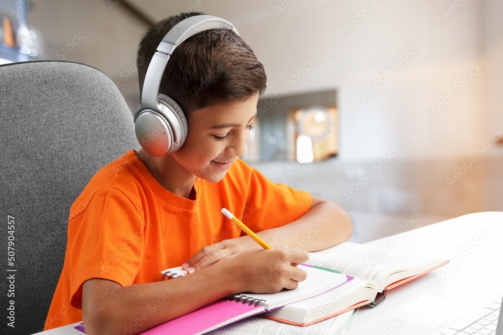 Portrait of smiling child studying at home, homeschooling concept Portrait of smiling child studying at home, homeschooling concept