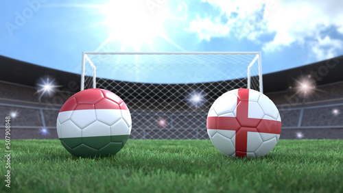 Two soccer balls in flags colors on stadium blurred background. Hungary and England. 3d image