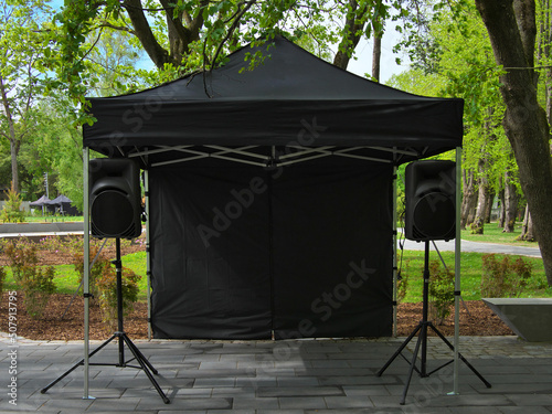 Black tent, two acoustic systems. Selective sharpness. photo