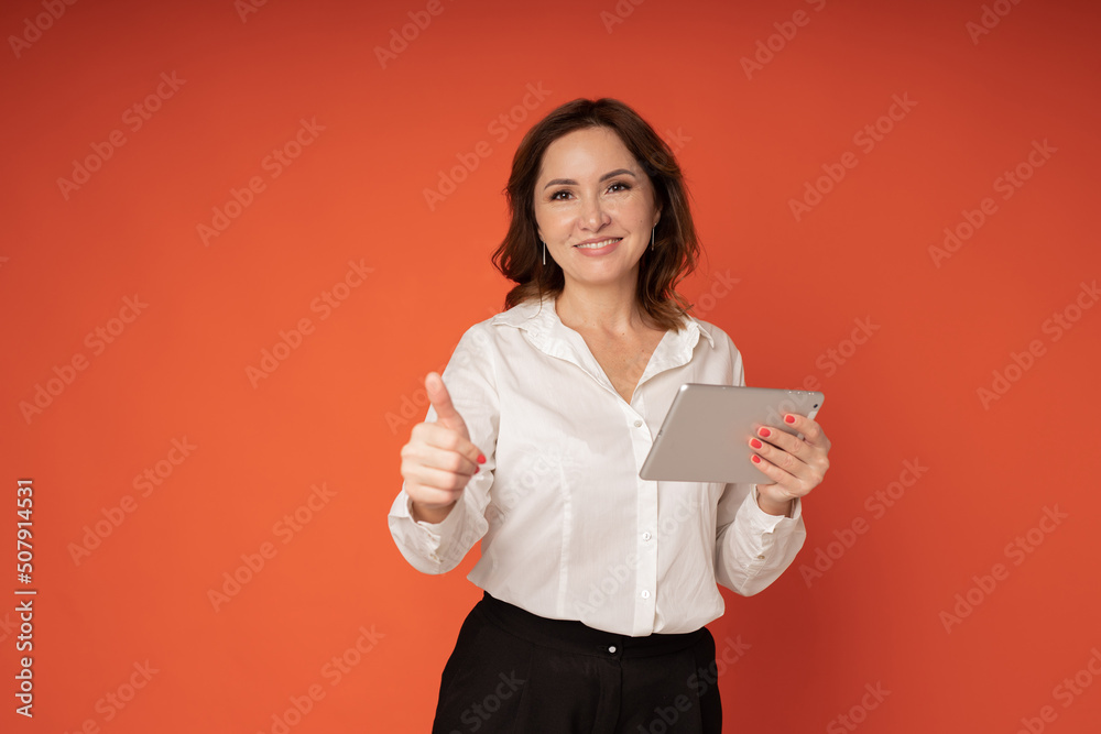 cheerful adult woman with tablet