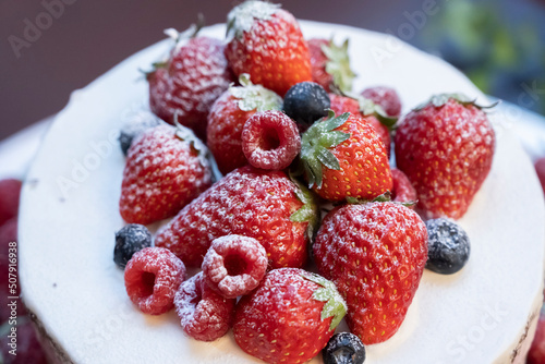 Two-tiered original cake with lots of strawberries