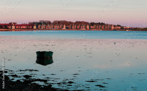 Lonely boat in Roskilde fjord in Denmark photo