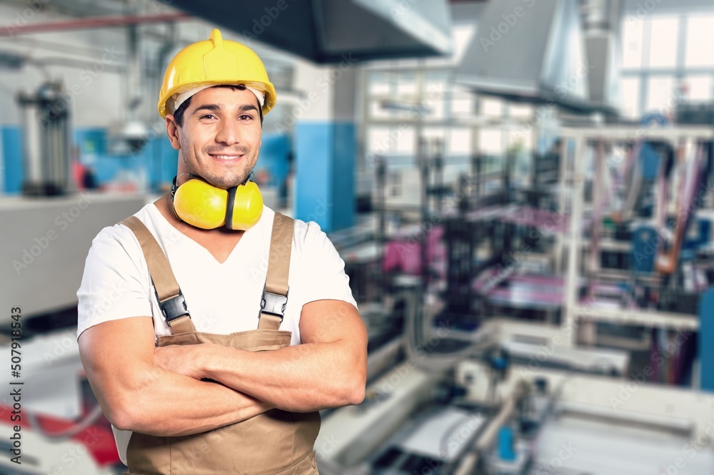 Portrait of happy smiling industrial worer with safety helmet, concept of safety measures, skilled labour and workforce. Portrait of happy smiling industrial worer with safety helmet, concept of safety measures, skilled labour and workforce.
