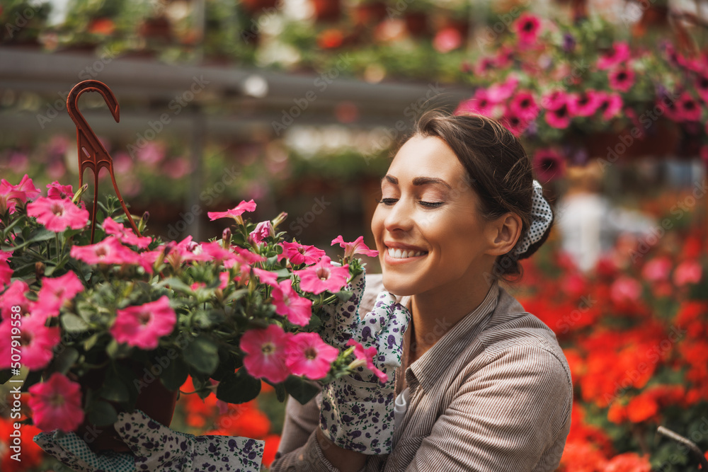 Florist Woman Care About Flowers In Garden Center