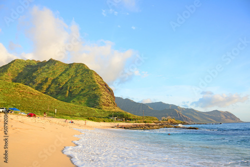Sunset at Yokohama beach in the summer time on the west side of the island of Oahu in Hawaii at Kaena Point