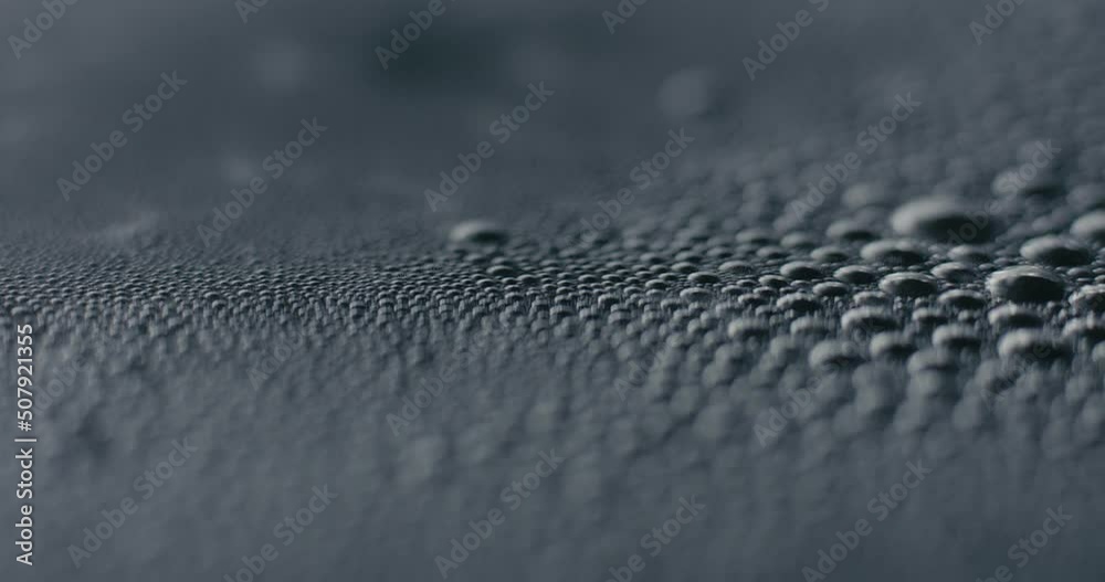 Boiling hot water bubbles on surface in macro close up