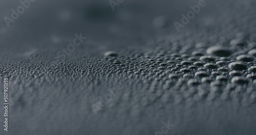 Boiling hot water bubbles on surface in macro close up photo