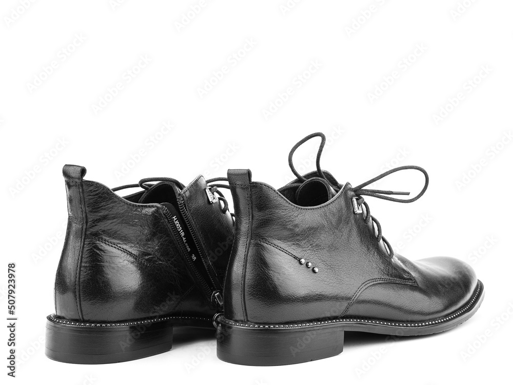 Men's autumn black leather jodhpur boots with laces and average heels, isolated white background. Back side view. Fashion shoes.