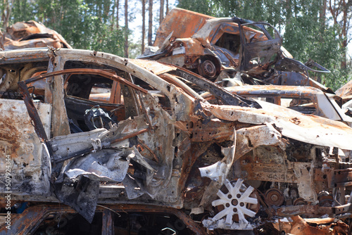 war in ukraine. Car graveyard. Shot cars of civilians. russia's war against Ukraine. Burnt and blown up car. Cars damaged after shelling. irpin bucha. war crimes