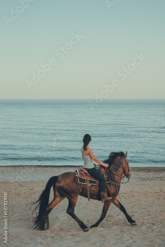 riding on the beach at sunset