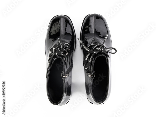 Obraz na płótnie black leather jodhpur boots isolated on white background. Top view. Fashion shoes. Photoshoot for shoe shop concept. w salonie