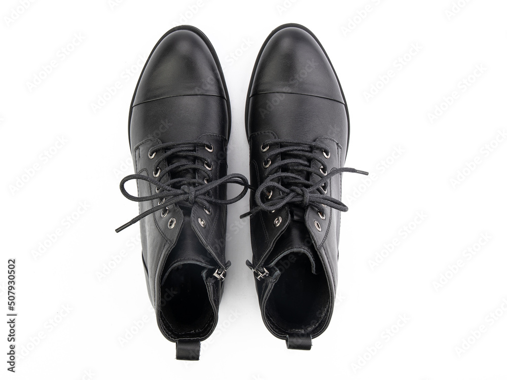 A pair of classic leather elegant men's shoes isolated white background. Groom's stylish black shoes. Isolated object close up on white background.