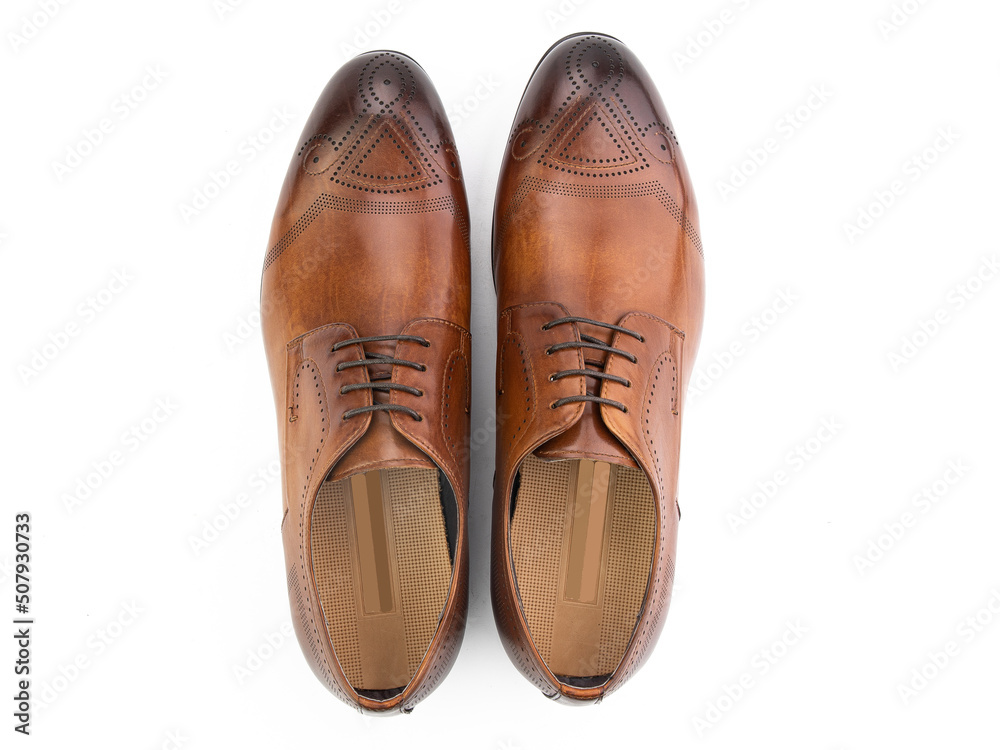 A pair of classic leather elegant men's shoes isolated white background. Groom's stylish black shoes. Isolated object close up on white background.