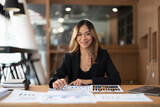 Portrair accountant asian woman working and analyzing financial reports project accounting with chart graph and calculator in modern office : finance and business concept.