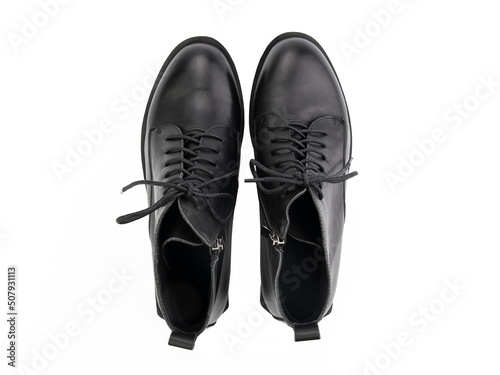Obraz na płótnie black leather jodhpur boots isolated on white background. Top view. Fashion shoes. Photoshoot for shoe shop concept. w salonie