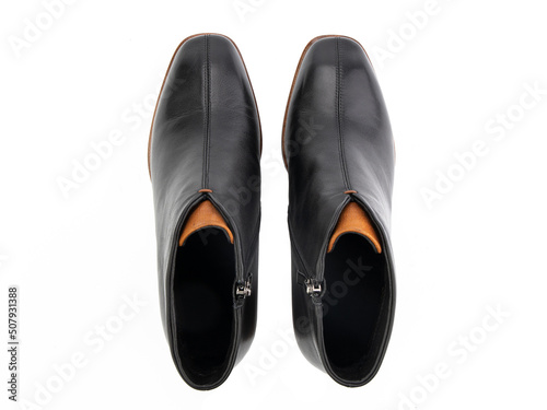 Obraz na płótnie black leather jodhpur boots isolated on white background. Top view. Fashion shoes. Photoshoot for shoe shop concept. w salonie