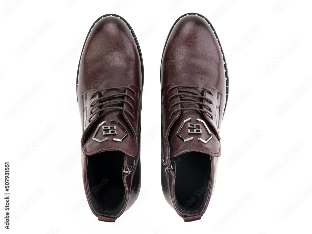 A pair of classic leather elegant men's shoes isolated white background. Groom's stylish black shoes. Isolated object close up on white background.