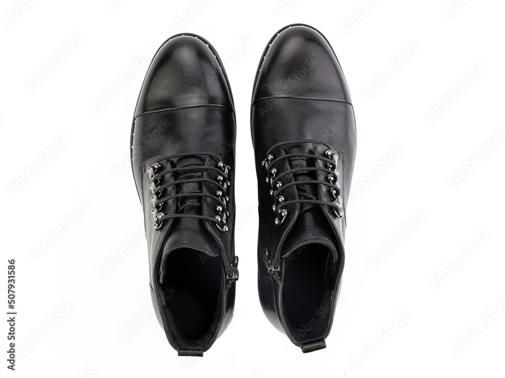 A pair of classic leather elegant men's shoes isolated white background. Groom's stylish black shoes. Isolated object close up on white background.