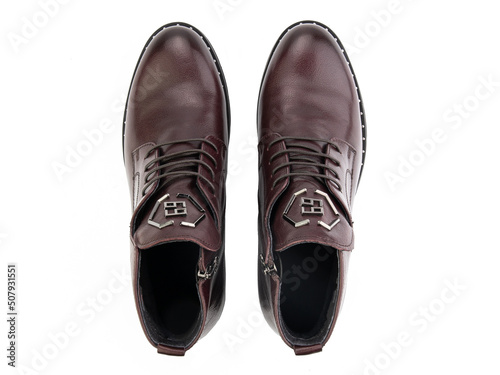 Obraz na płótnie A pair of classic leather elegant men's shoes isolated white background. Groom's stylish black shoes. Isolated object close up on white background. w salonie