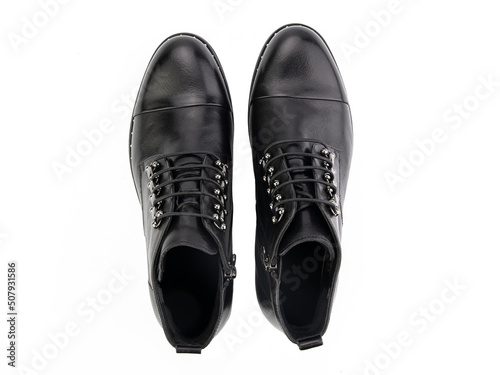Obraz na płótnie A pair of classic leather elegant men's shoes isolated white background. Groom's stylish black shoes. Isolated object close up on white background. w salonie