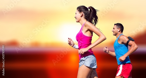 People sport running concept. Happy runner couple exercising outside as part of healthy lifestyle.