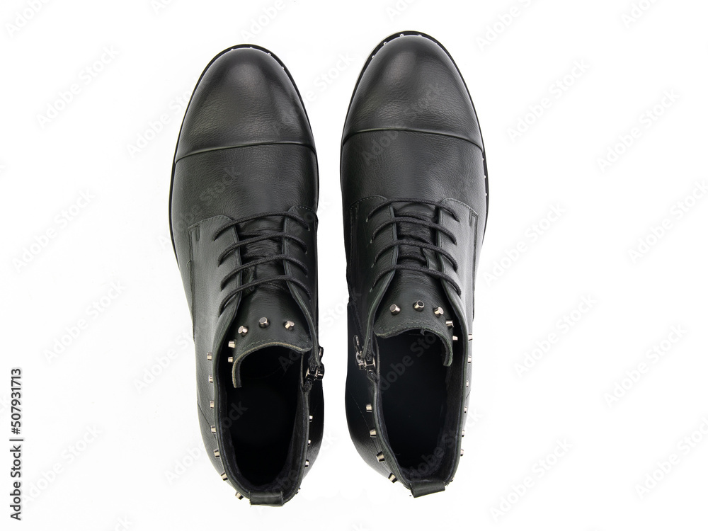 A pair of classic leather elegant men's shoes isolated white background. Groom's stylish black shoes. Isolated object close up on white background.