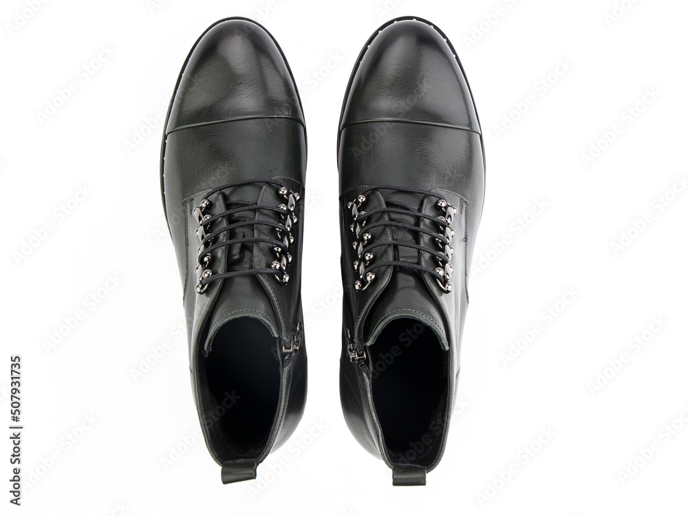 A pair of classic leather elegant men's shoes isolated white background. Groom's stylish black shoes. Isolated object close up on white background.