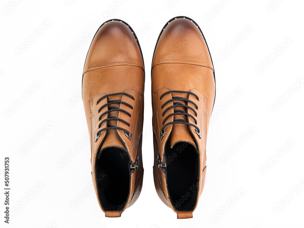 A pair of classic leather elegant men's shoes isolated white background. Groom's stylish black shoes. Isolated object close up on white background.