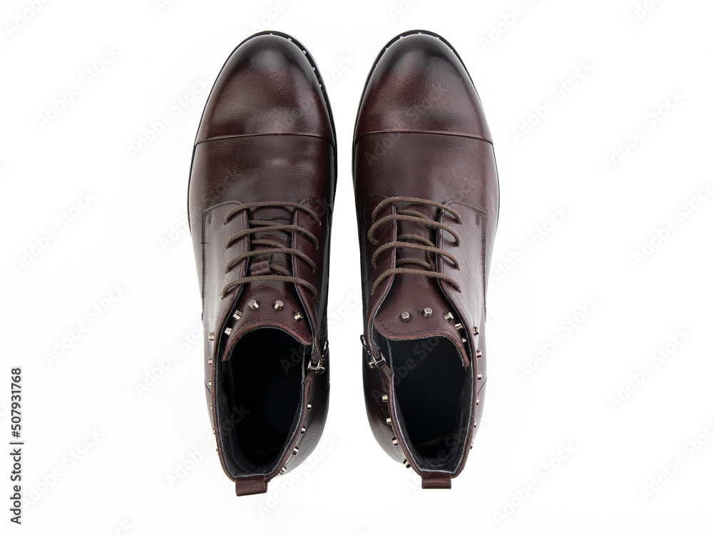 A pair of classic leather elegant men's shoes isolated white background. Groom's stylish black shoes. Isolated object close up on white background.