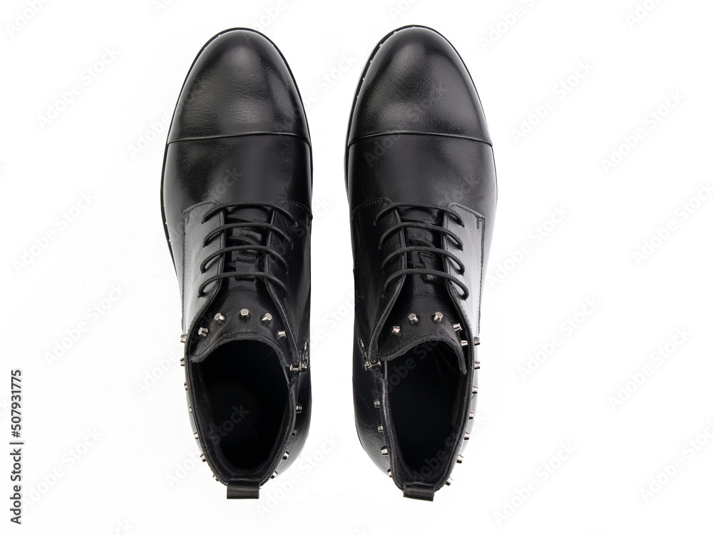 A pair of classic leather elegant men's shoes isolated white background. Groom's stylish black shoes. Isolated object close up on white background.
