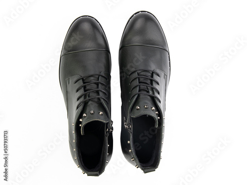Obraz na płótnie A pair of classic leather elegant men's shoes isolated white background. Groom's stylish black shoes. Isolated object close up on white background. w salonie