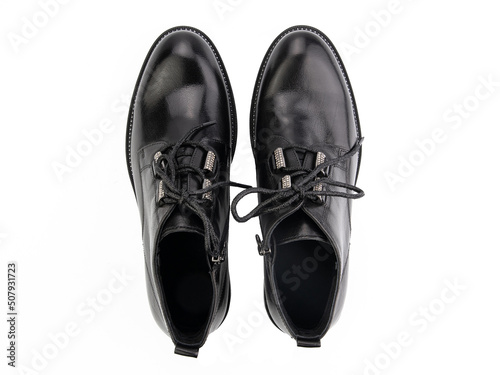 Obraz na płótnie A pair of classic leather elegant men's shoes isolated white background. Groom's stylish black shoes. Isolated object close up on white background. w salonie