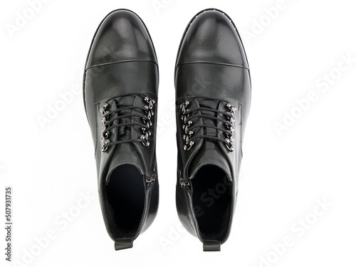 Obraz na płótnie A pair of classic leather elegant men's shoes isolated white background. Groom's stylish black shoes. Isolated object close up on white background. w salonie