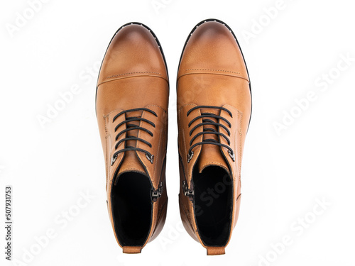 Obraz na płótnie A pair of classic leather elegant men's shoes isolated white background. Groom's stylish black shoes. Isolated object close up on white background. w salonie