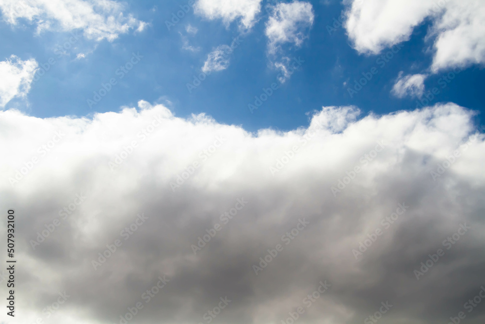 Fototapeta premium Cumulus clouds. White clouds on a blue background.