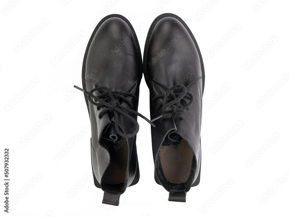 A pair of classic leather elegant men's shoes isolated white background. Groom's stylish black shoes. Isolated object close up on white background.