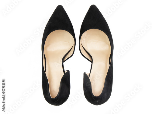 Classic and elegant high-heeled women shoes. Stylish black shoes on high thin heels and with a pointed toe. Isolated object close up on white background. Top view.