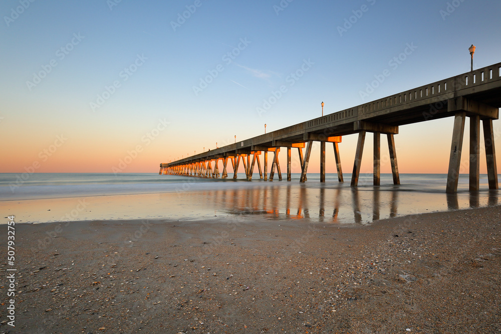 Beautiful  sunset over Jennette's Pier , Nags Head North Carolina. Originally built in 1939, Jennette’s is the oldest fishing pier on the Outer Banks, NC USA
